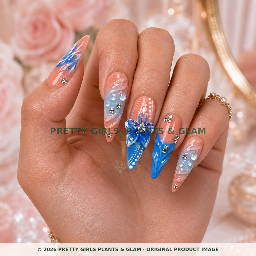 Blue Serenity press-on nails modeled upright on a hand