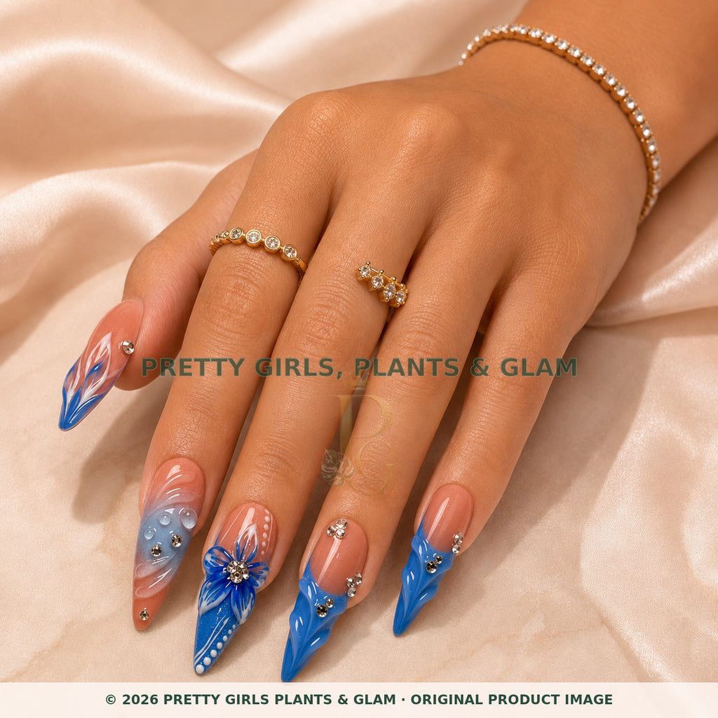 Blue Serenity press-on nails modeled on a hand