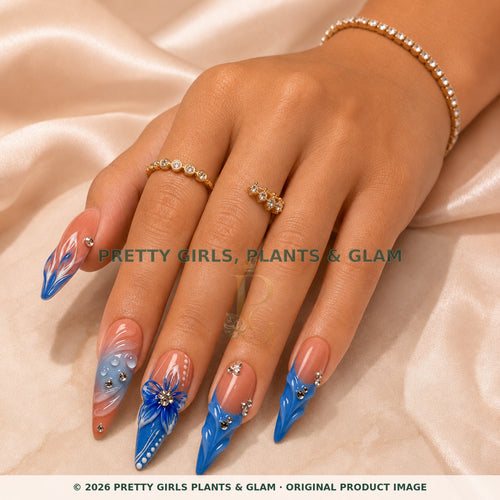 Blue Serenity press-on nails modeled on a hand