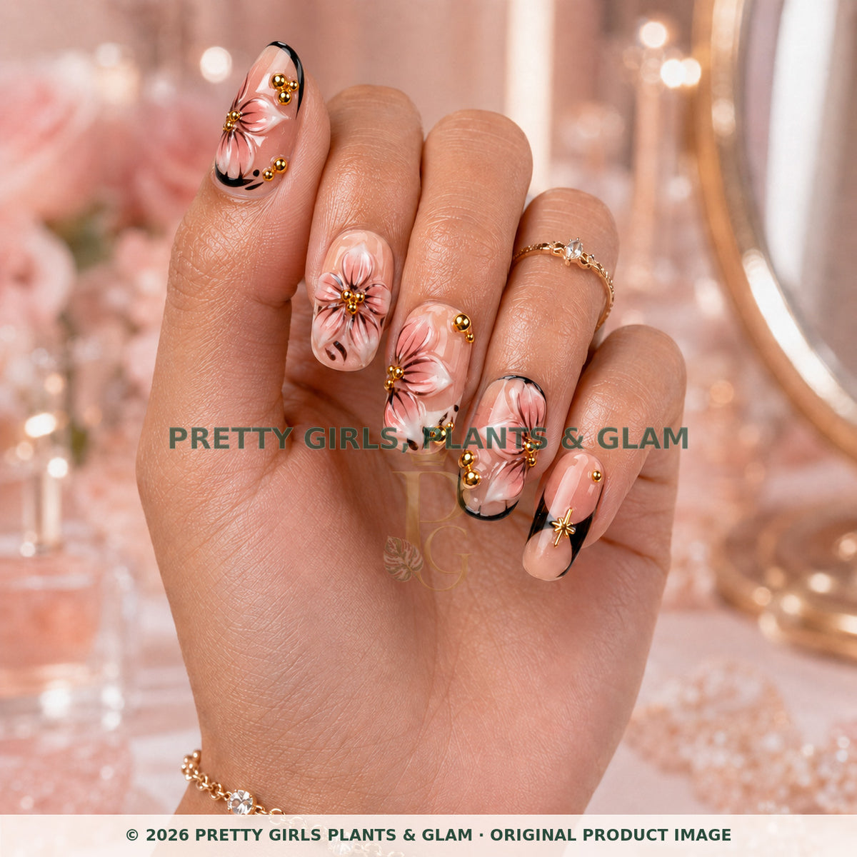 Blush Floral Medallion press-on nails modeled upright on a hand