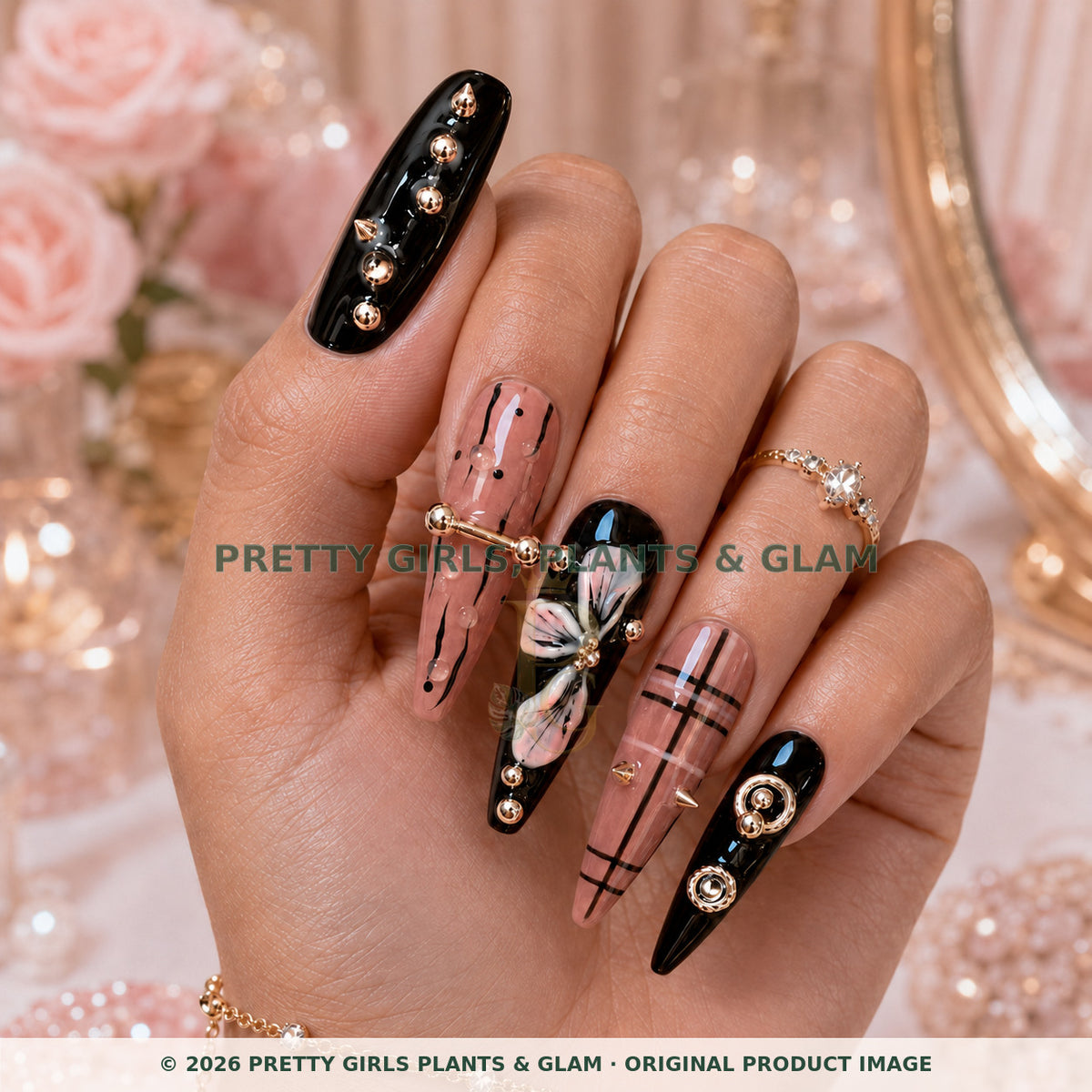 Blush Noir press-on nails modeled upright on a hand