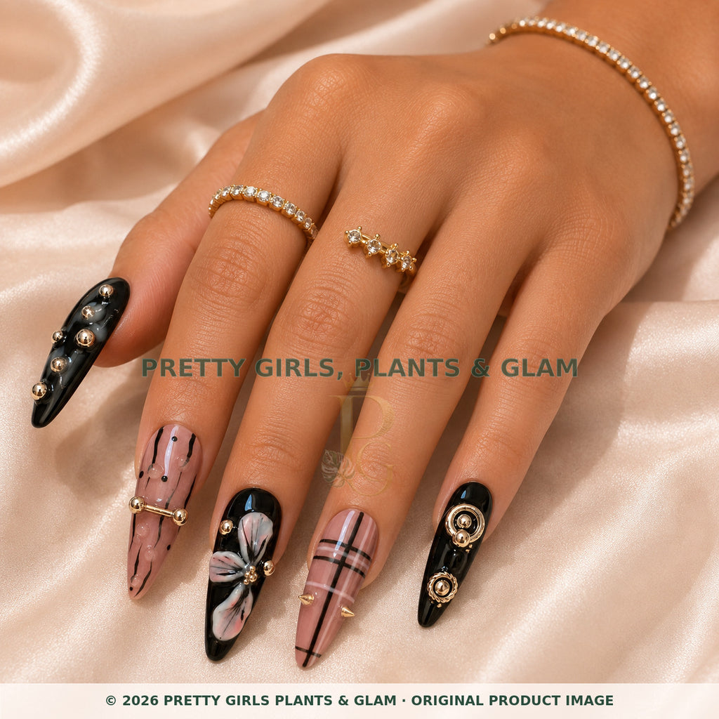 Blush Noir press-on nails modeled on a hand