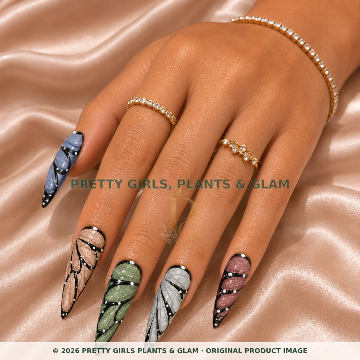Butterfly Wings press-on nails modeled on a hand