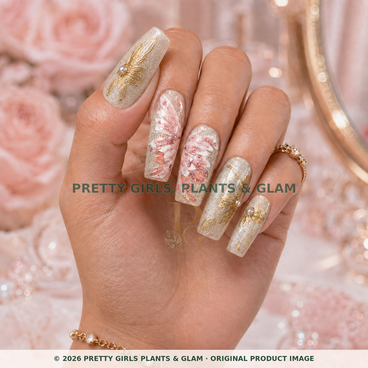 Champagne Garden press-on nails modeled upright on a hand