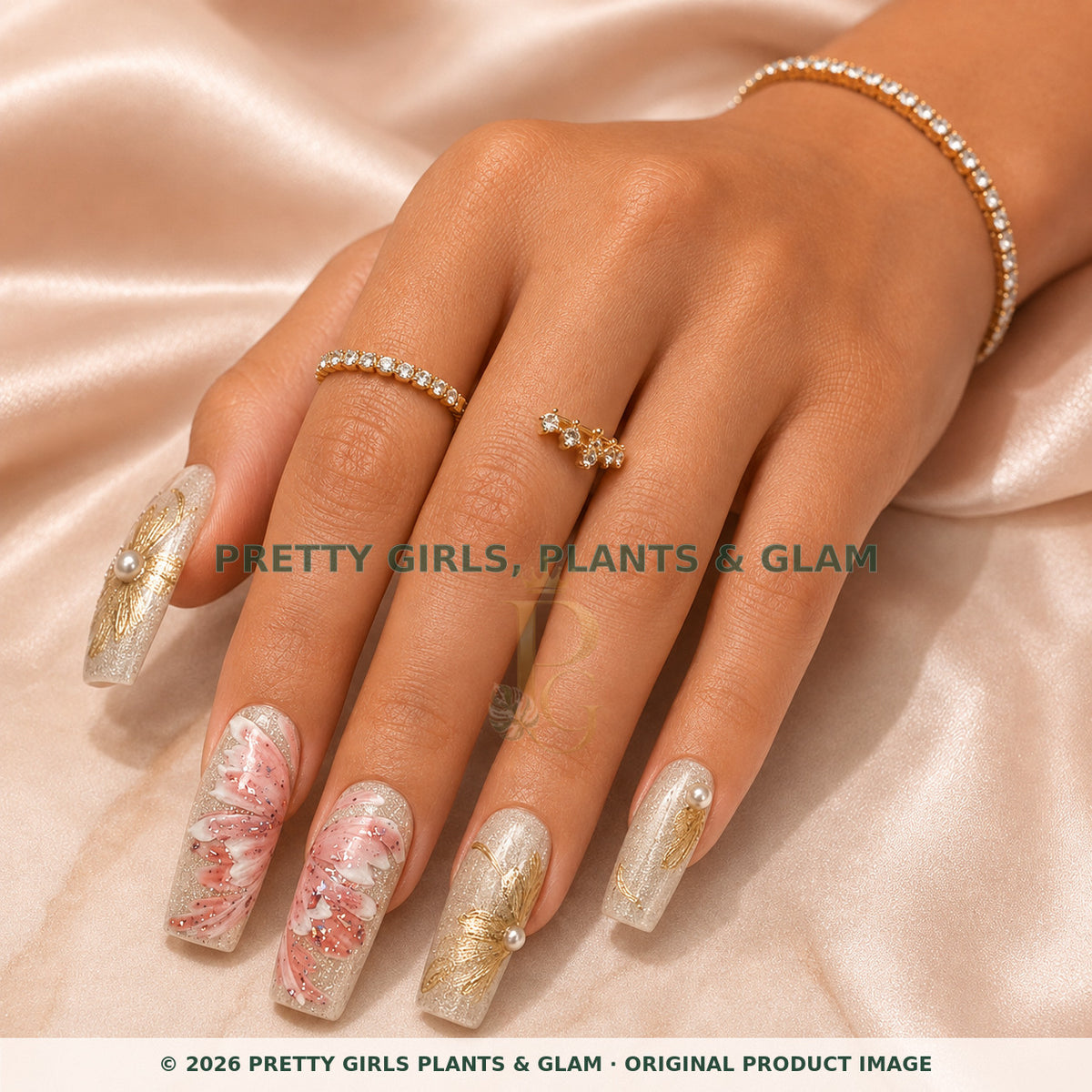 Champagne Garden press-on nails modeled on a hand