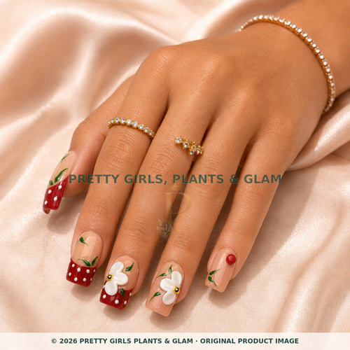 Cherry Daisy press-on nails modeled on a hand