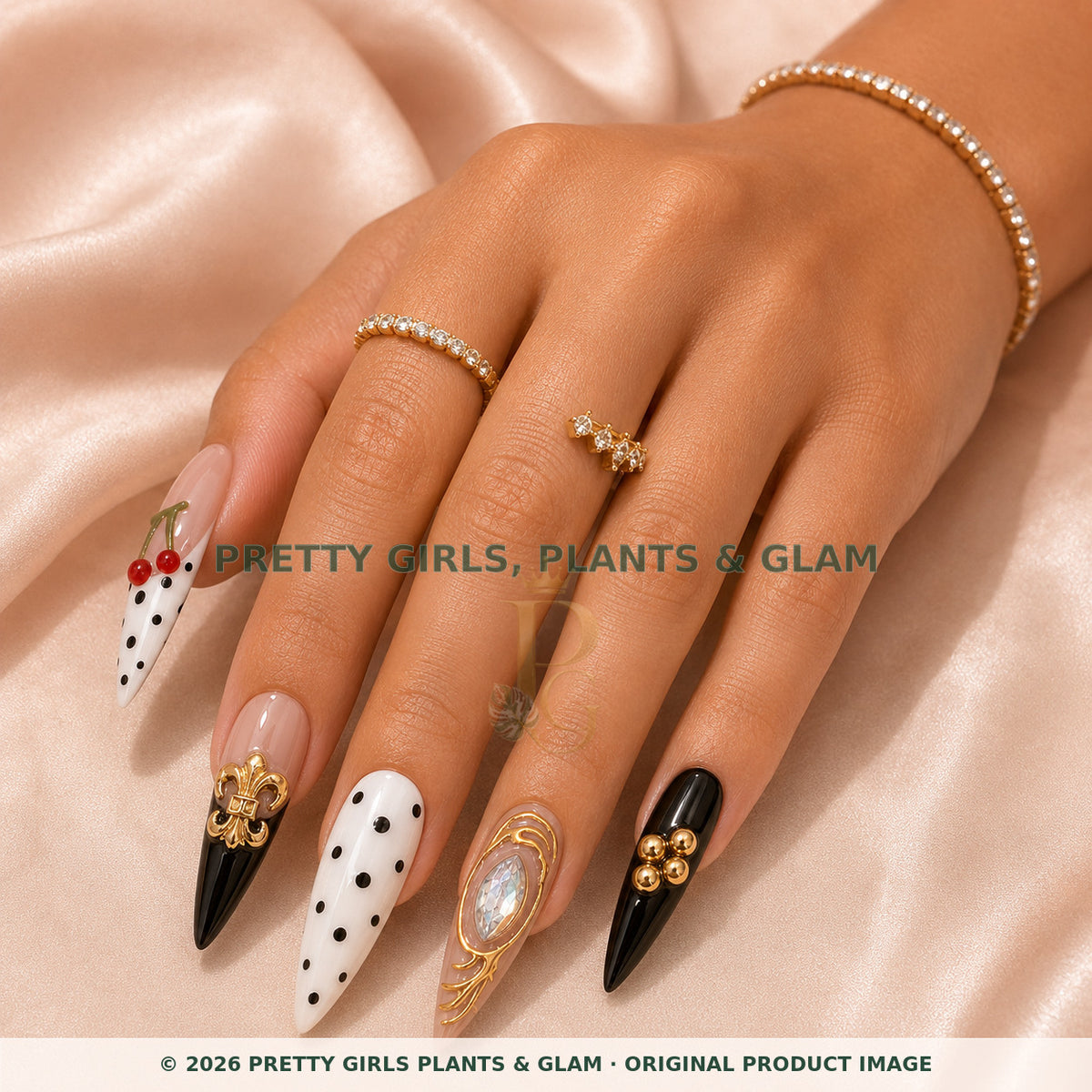 Cherry Royale press-on nails modeled on a hand