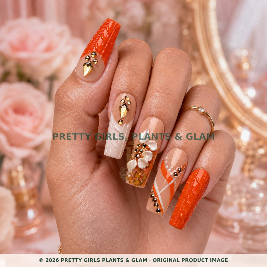 Coral Luxe press-on nails modeled upright on a hand