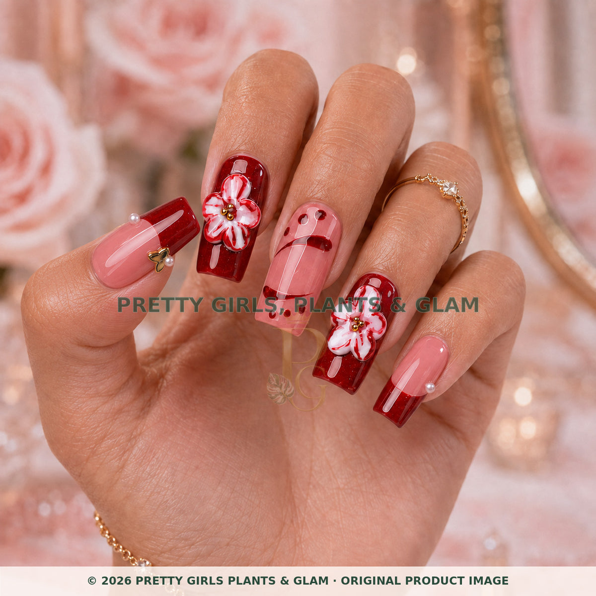 Crimson Petal French press-on nails modeled upright on a hand