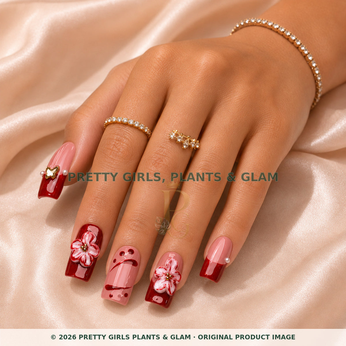 Crimson Petal French press-on nails modeled on a hand