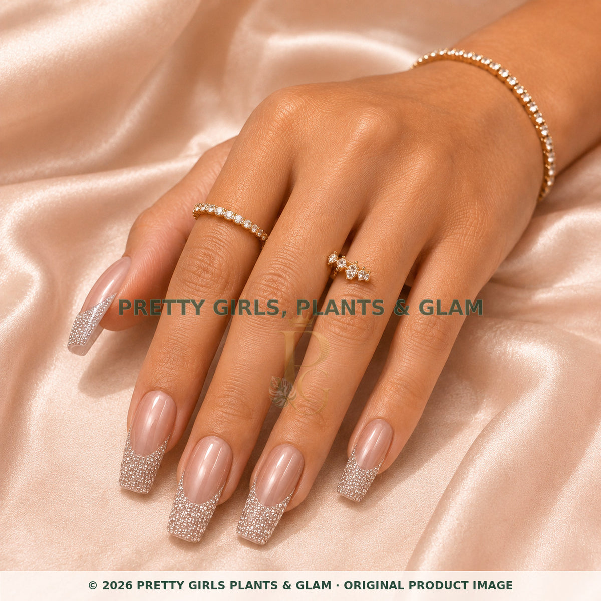 Crystal Champagne press-on nails modeled on a hand