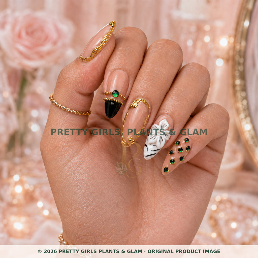 Emerald Crown Luxe press-on nails modeled upright on a hand