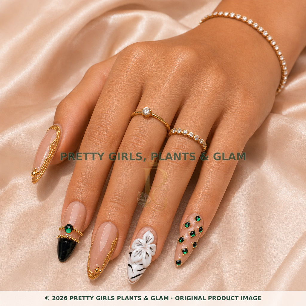 Emerald Crown Luxe press-on nails modeled on a hand