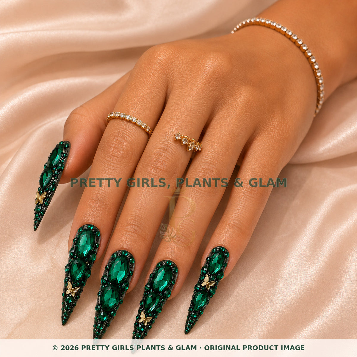 Emerald Secret press-on nails modeled on a hand