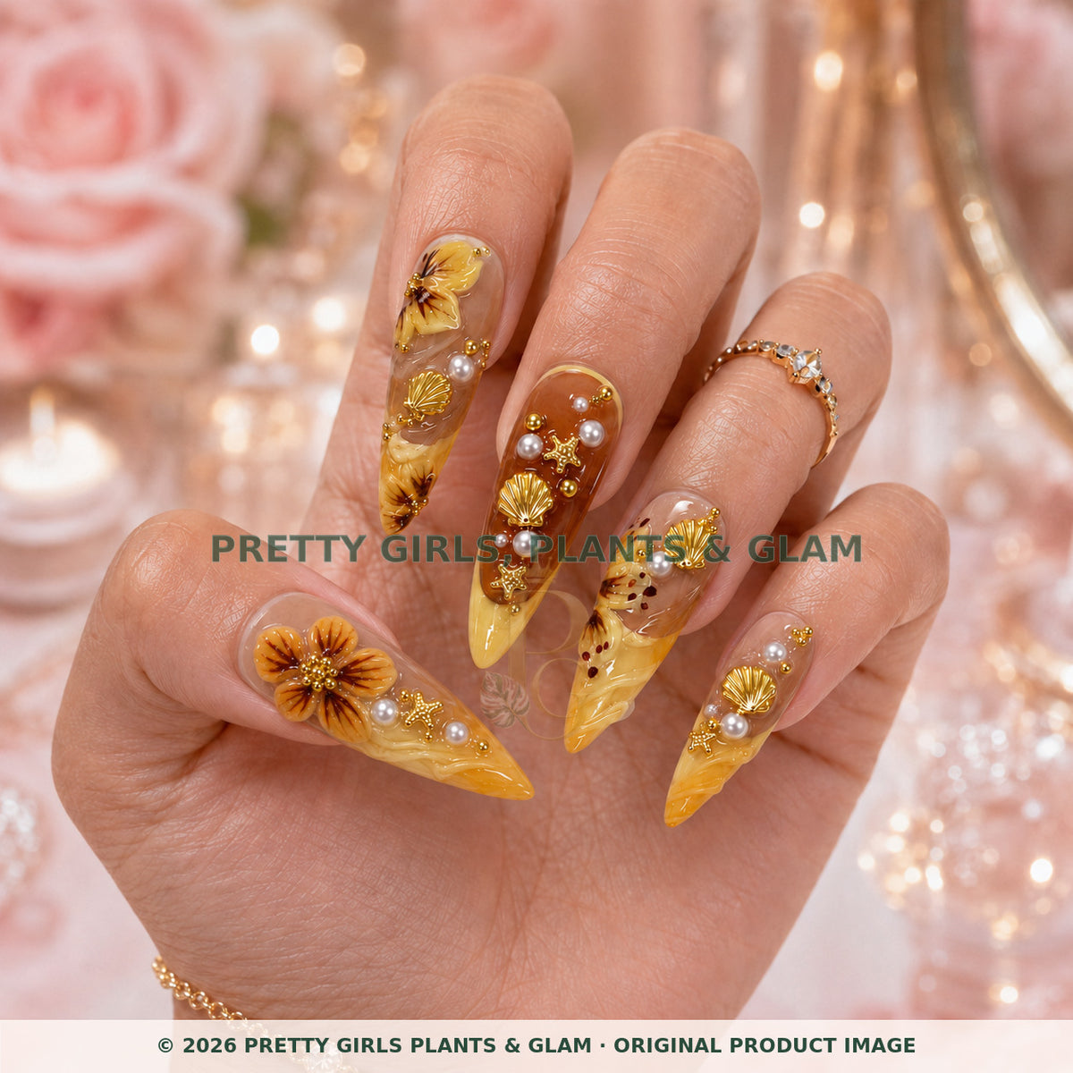 Golden Hour press-on nails modeled upright on a hand