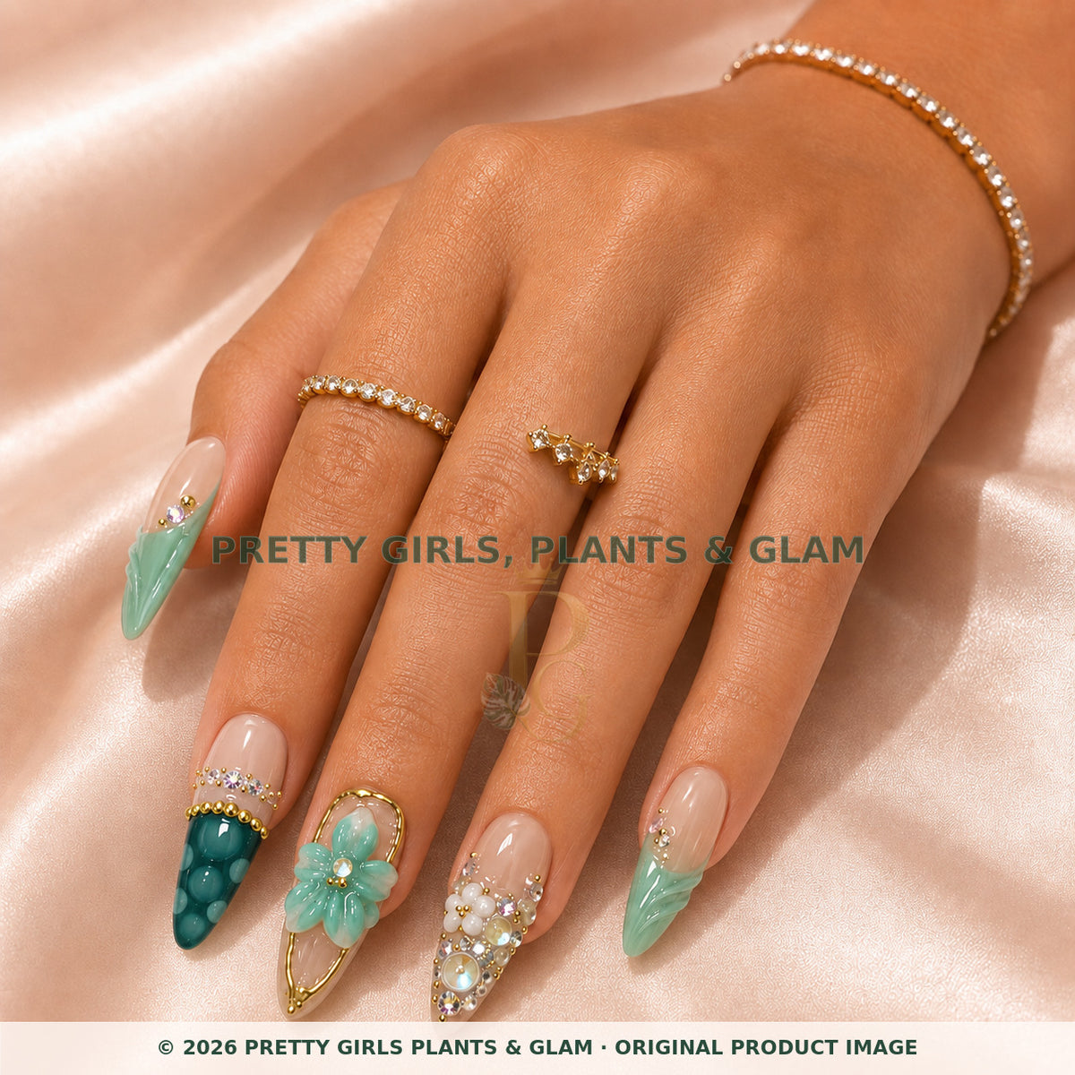 Jade Garden press-on nails modeled on a hand