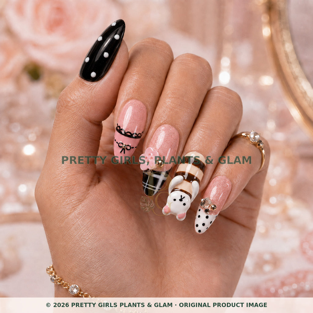 Kawaii Melody press-on nails modeled upright on a hand