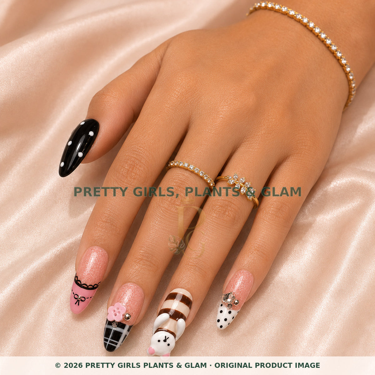 Kawaii Melody press-on nails modeled on a hand