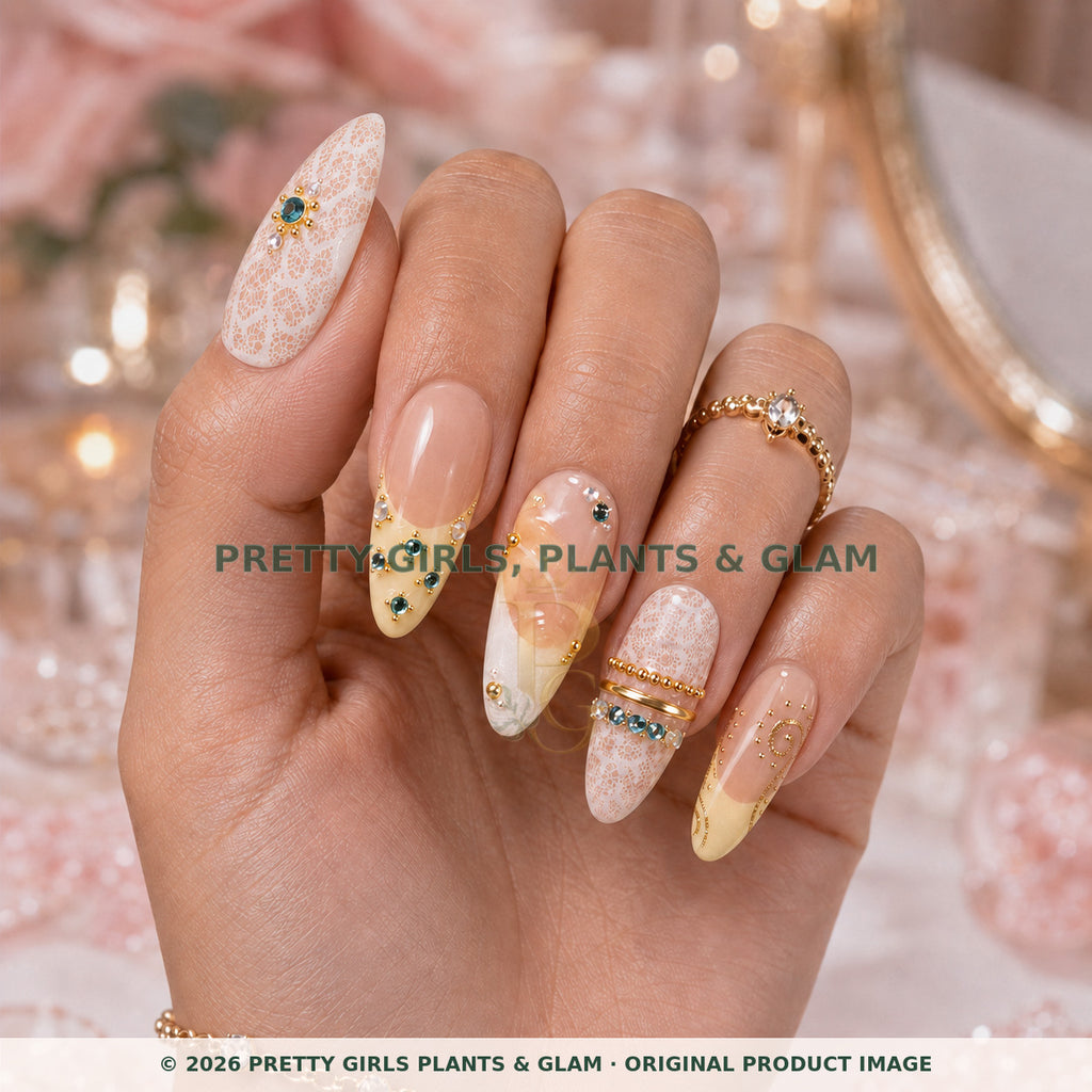 Lemon Lace press-on nails modeled upright on a hand