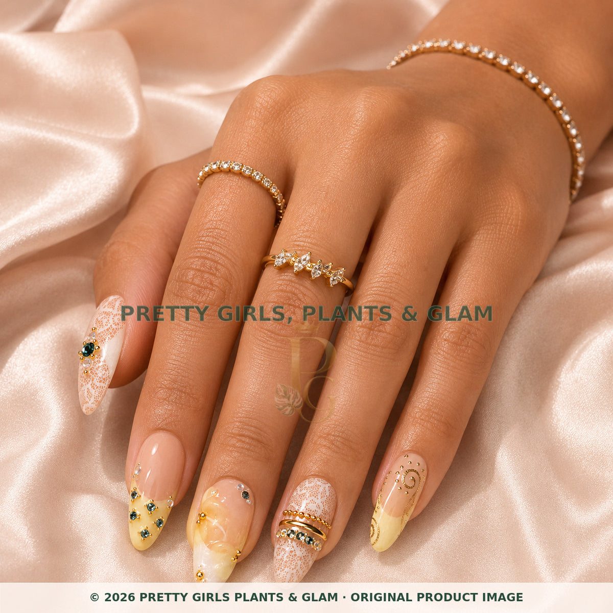 Lemon Lace press-on nails modeled on a hand