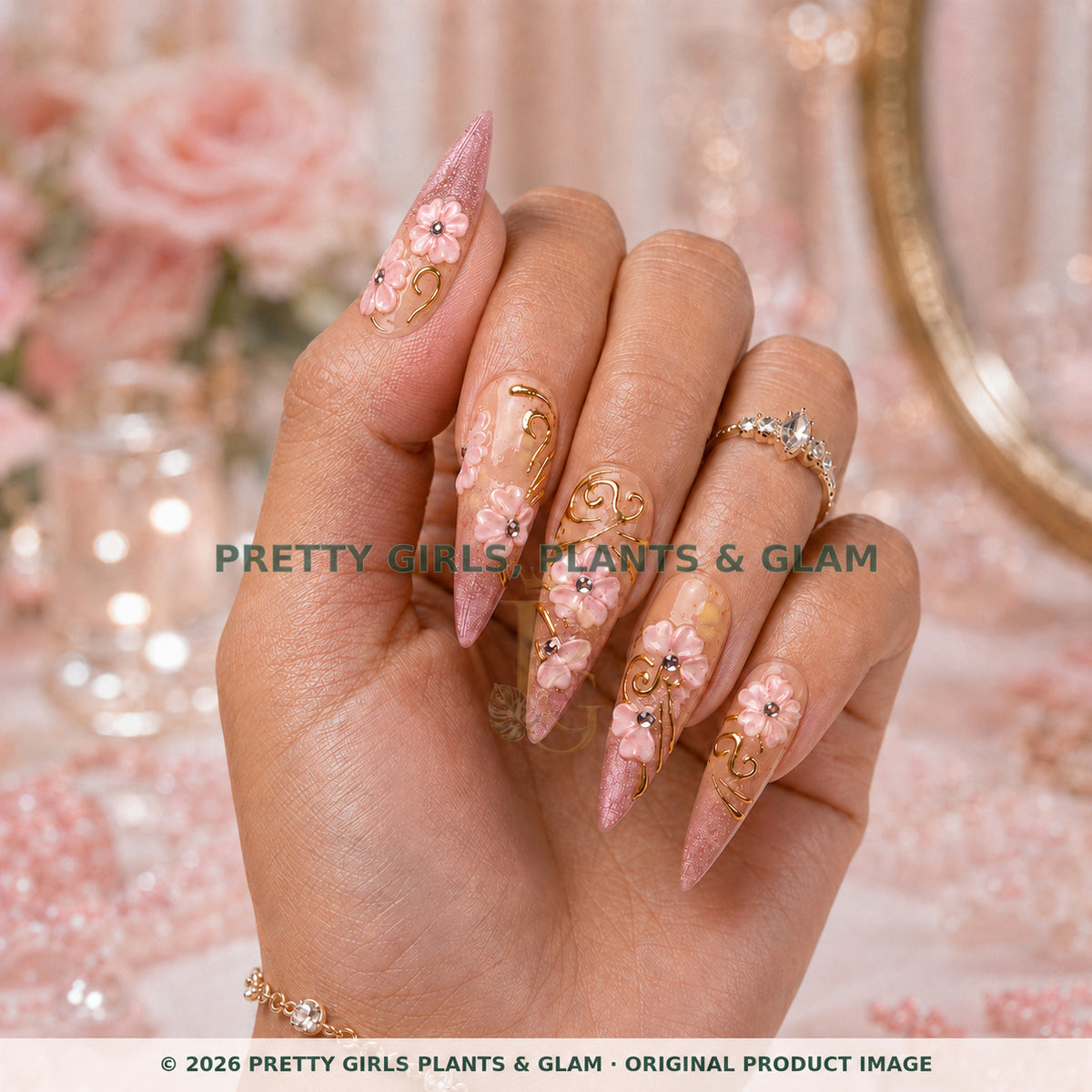 Mauve Garden press-on nails modeled upright on a hand