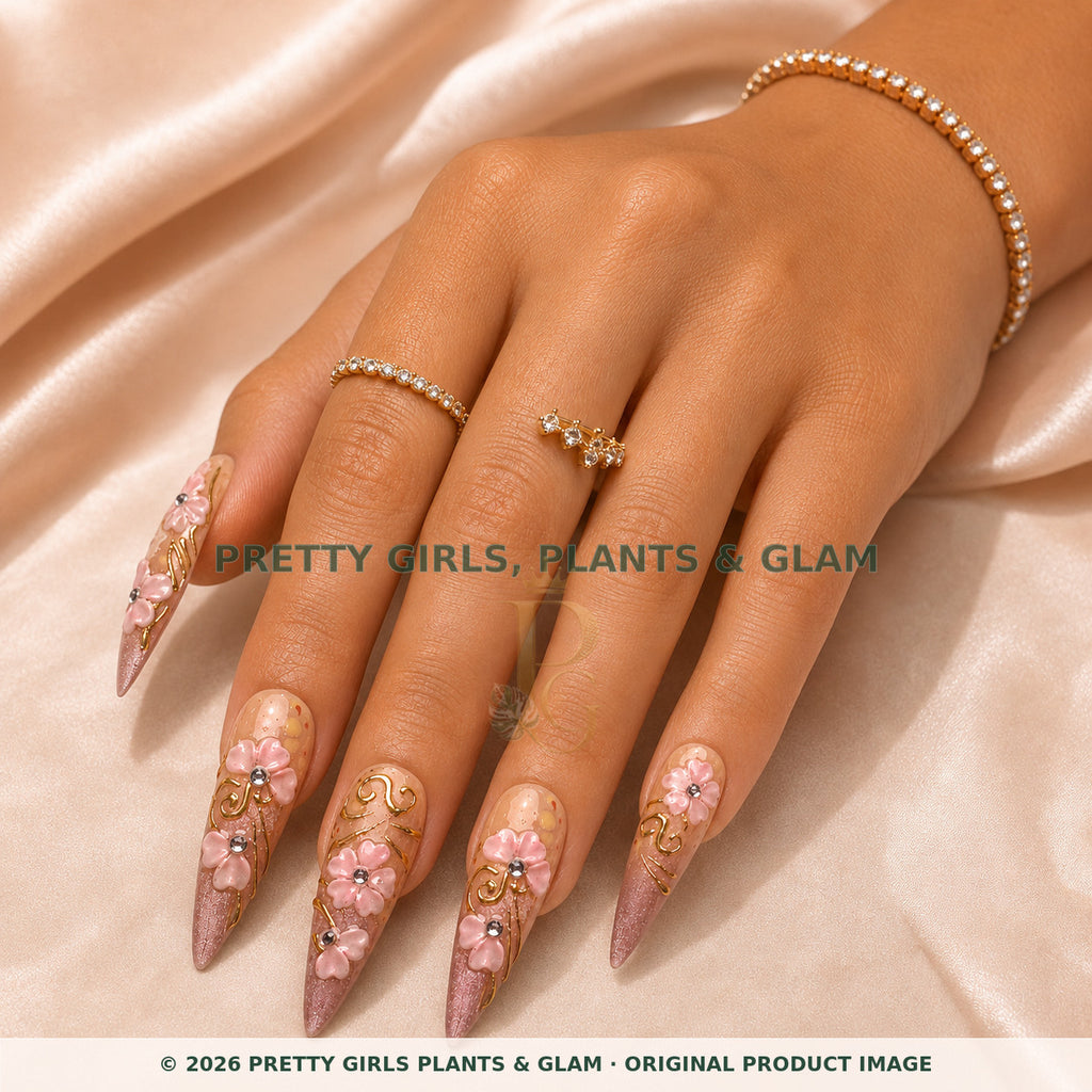 Mauve Garden press-on nails modeled on a hand