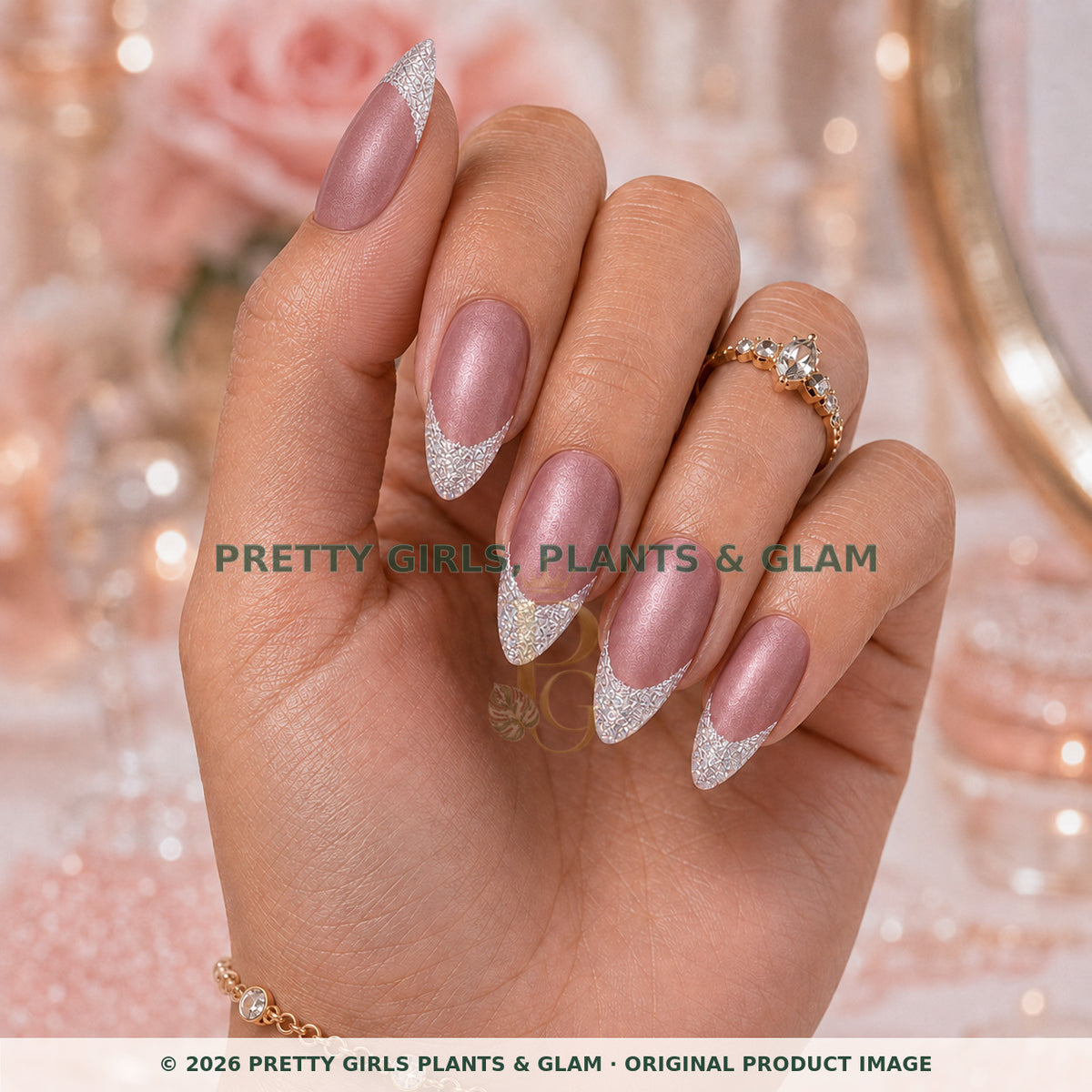 Mauve Stardust press-on nails modeled upright on a hand