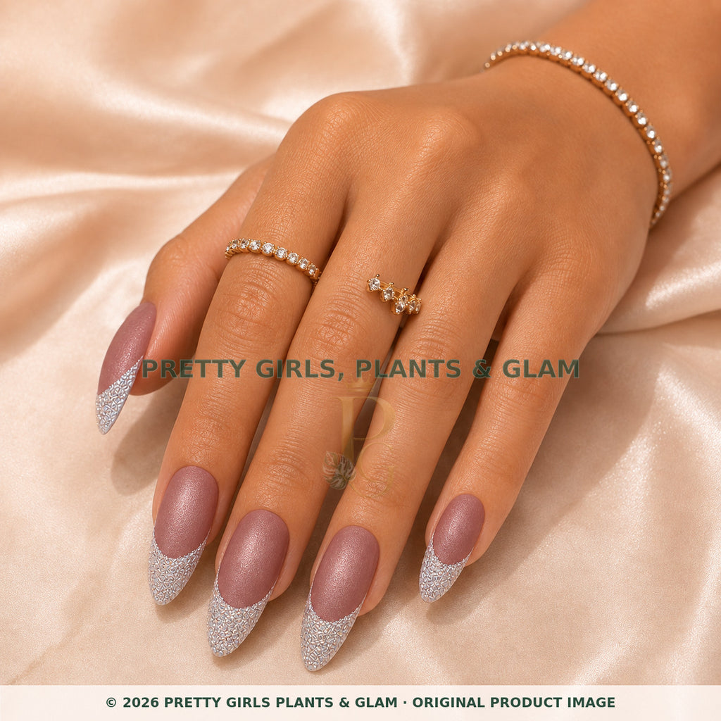 Mauve Stardust press-on nails modeled on a hand