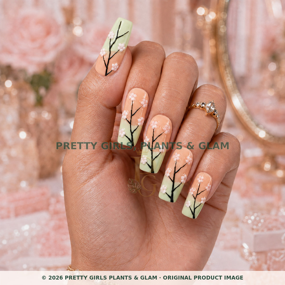 Mint Blossom press-on nails modeled upright on a hand