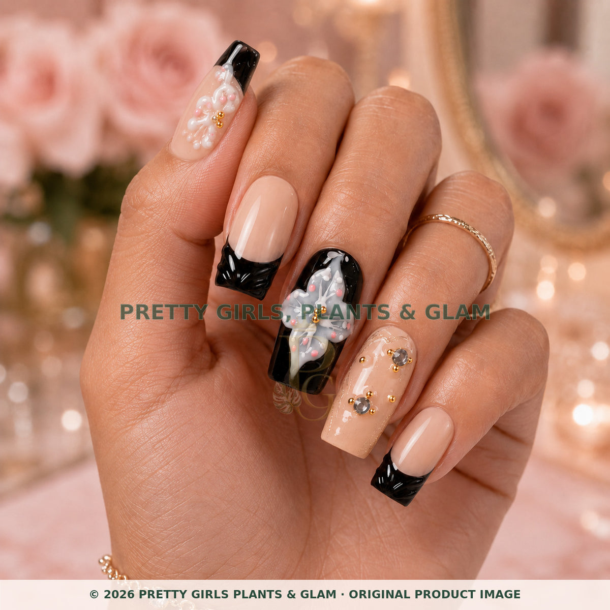 Noir Lily press-on nails modeled upright on a hand