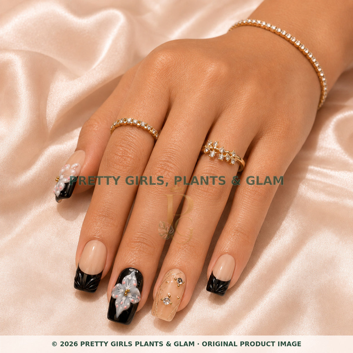 Noir Lily press-on nails modeled on a hand