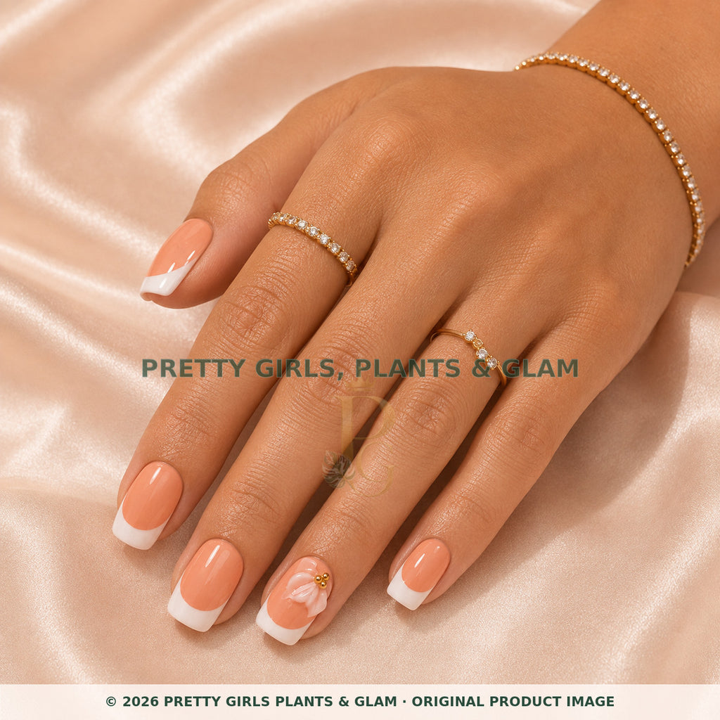 Peach Petal French press-on nails modeled on a hand