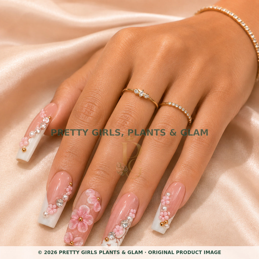 Pink Blossom press-on nails modeled on a hand