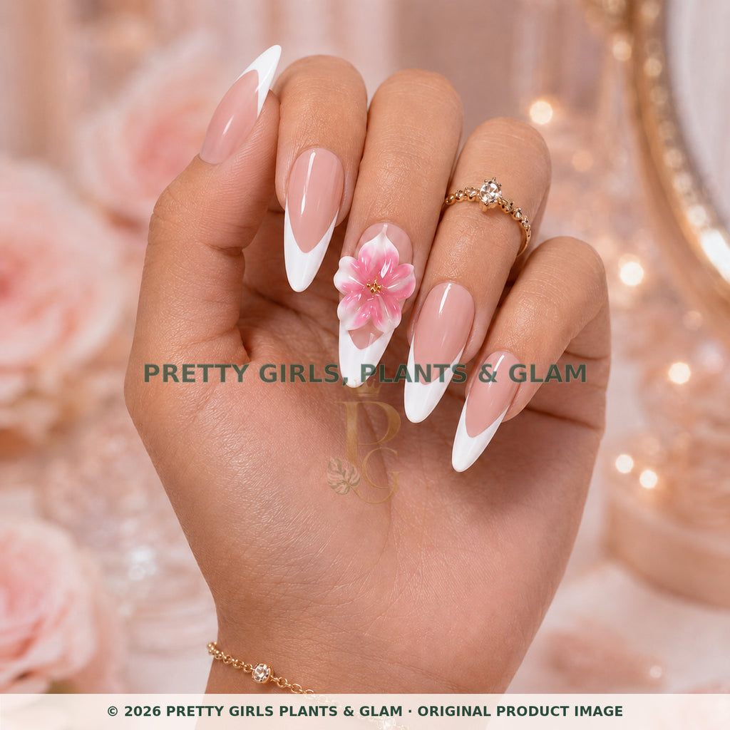 Pink French Bloom press-on nails modeled upright on a hand