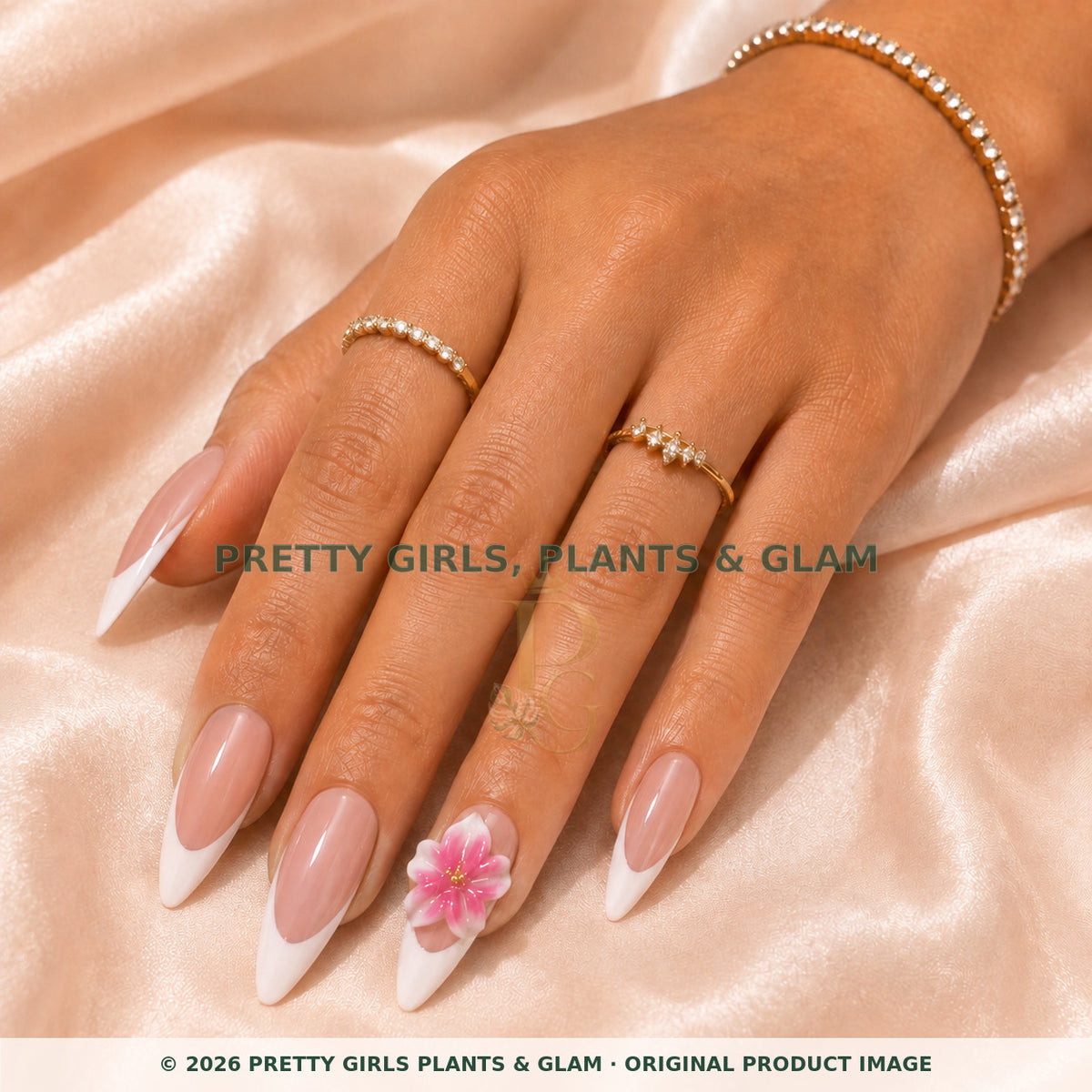 Pink French Bloom press-on nails modeled on a hand