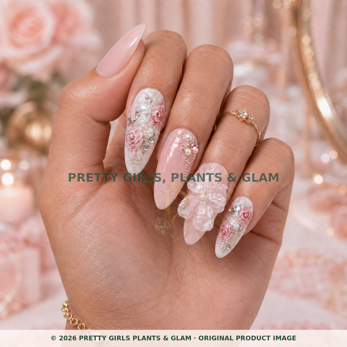 Porcelain Rose press-on nails modeled upright on a hand