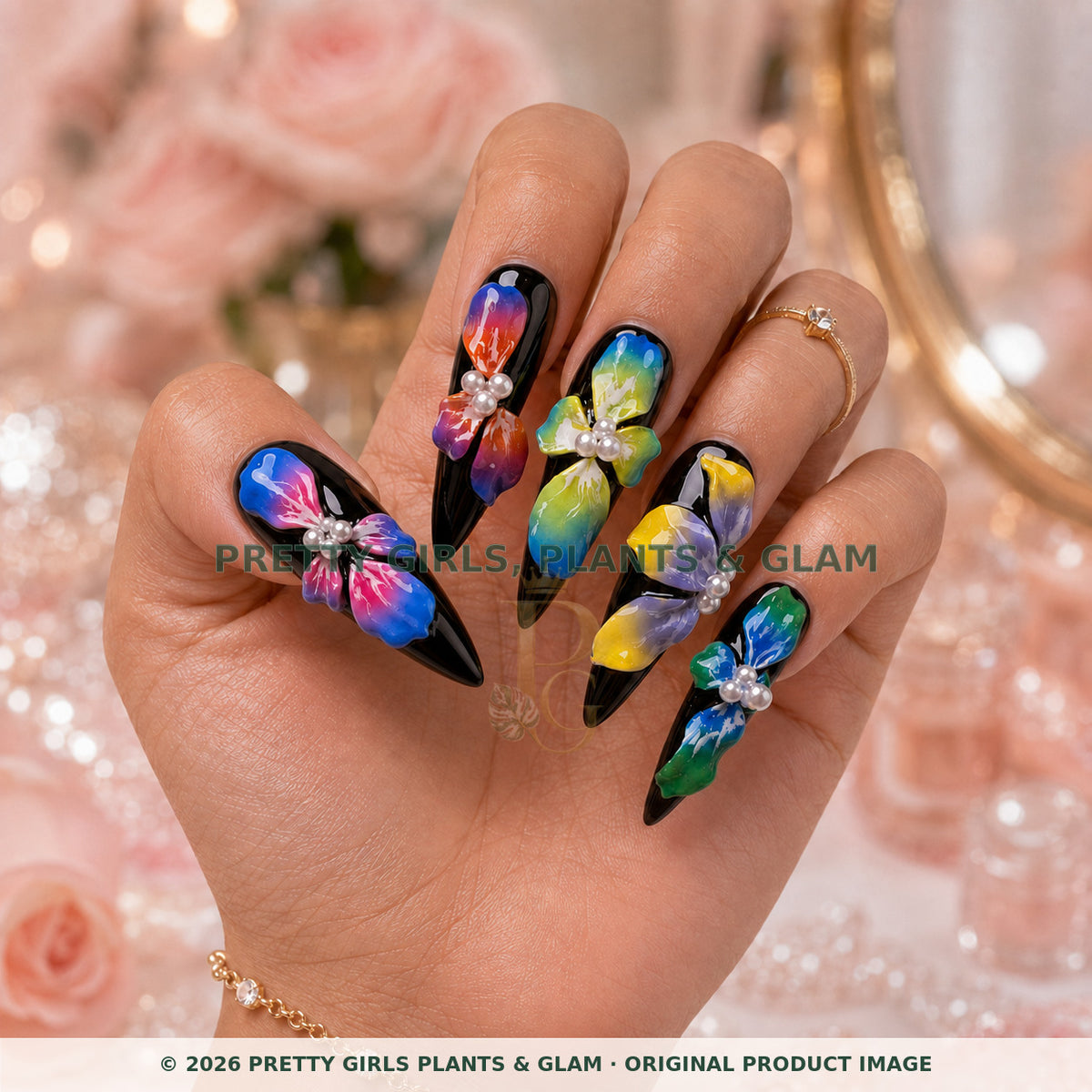 Rainbow Orchid Noir press-on nails modeled upright on a hand