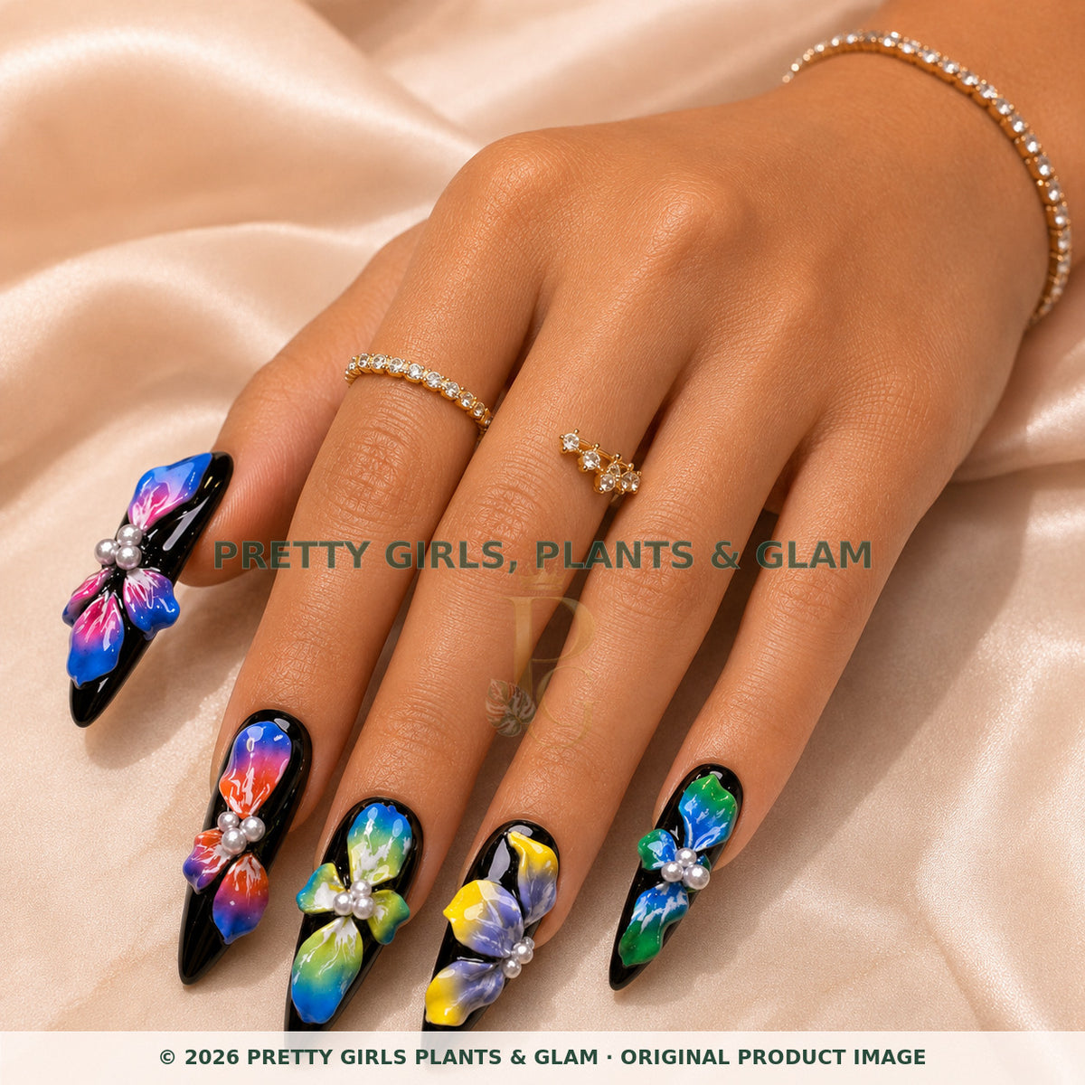 Rainbow Orchid Noir press-on nails modeled on a hand