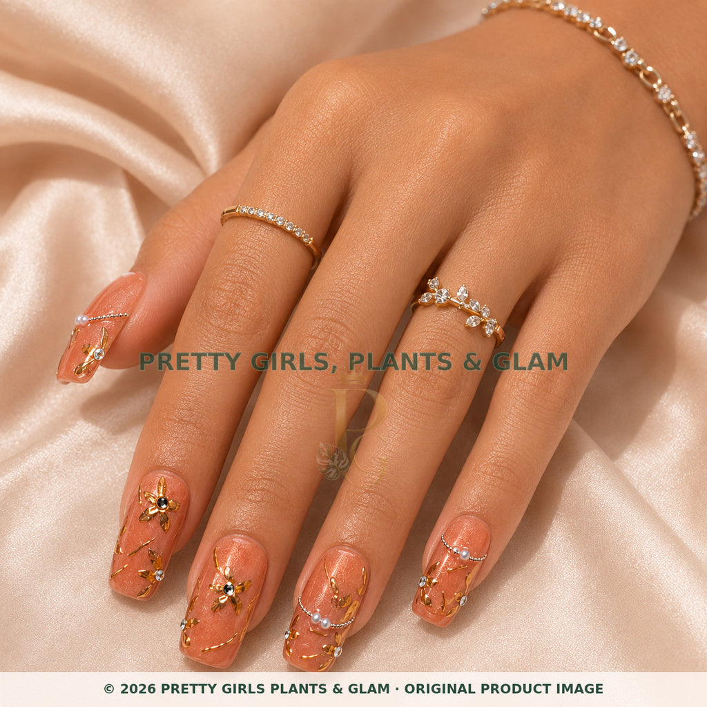 Rose Gold Vine press-on nails modeled on a hand