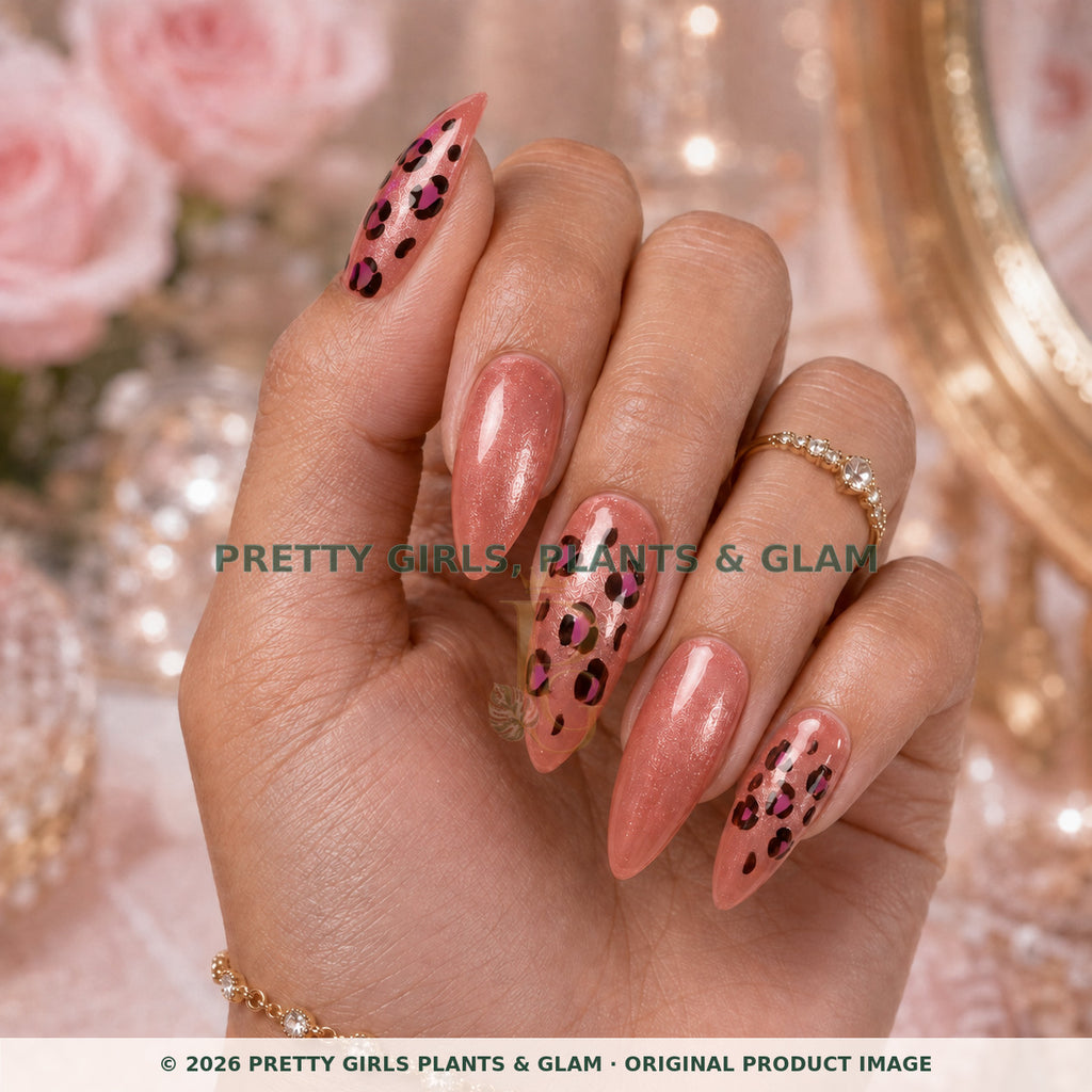 Rose Leopard press-on nails modeled upright on a hand