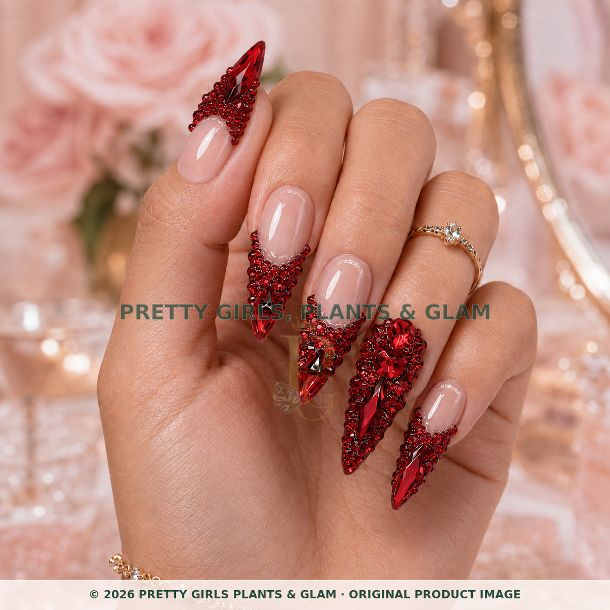 Ruby Romance press-on nails modeled upright on a hand