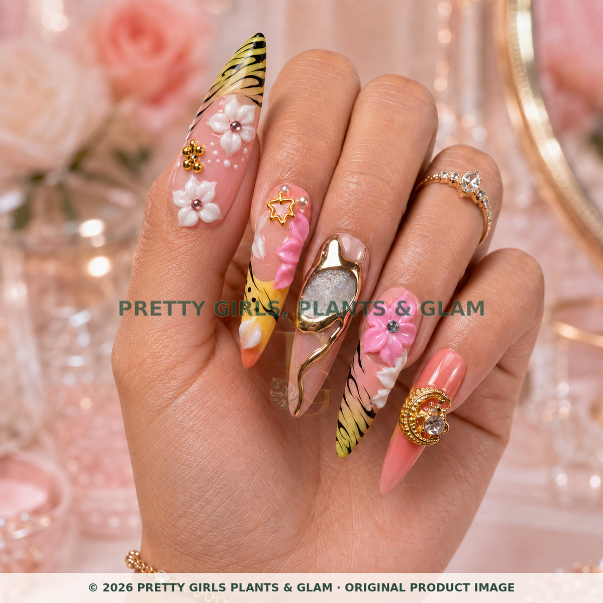 Safari Sunset press-on nails modeled upright on a hand