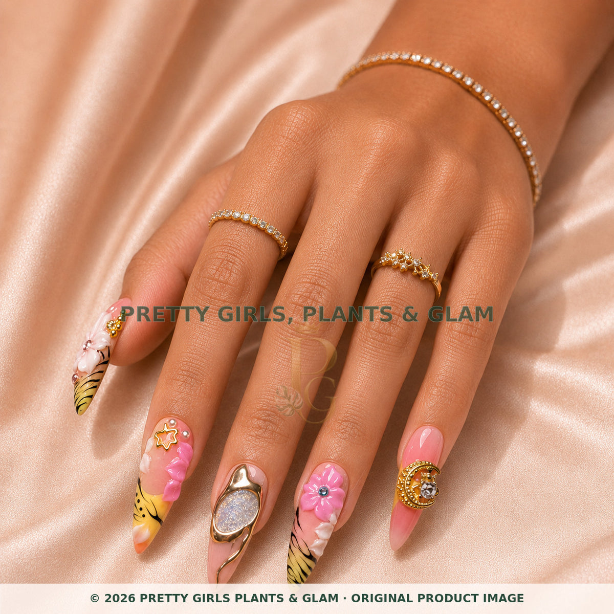 Safari Sunset press-on nails modeled on a hand