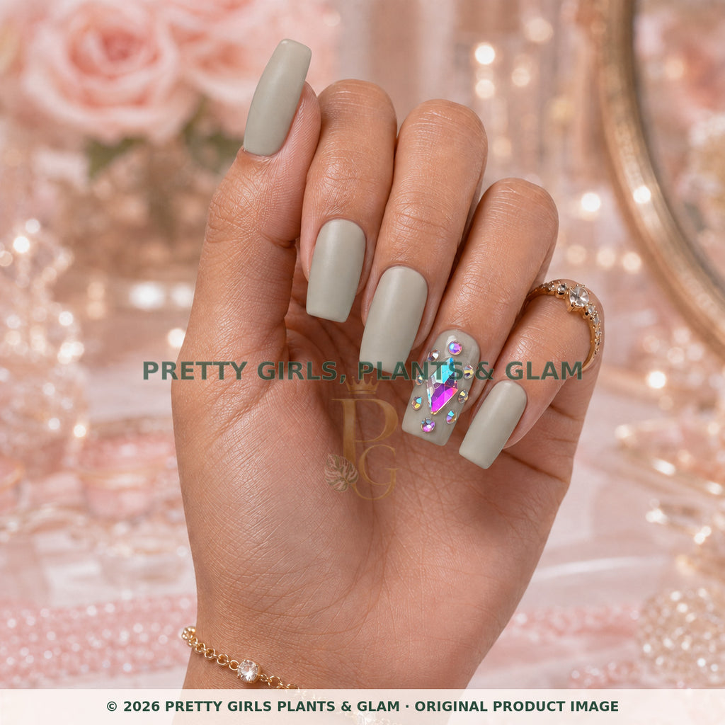 Sage Crystal press-on nails modeled upright on a hand