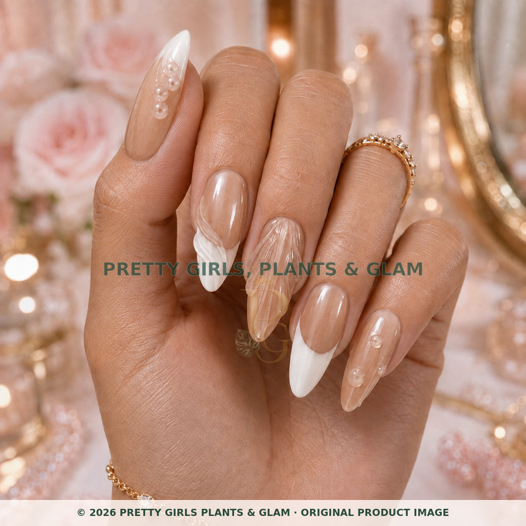 Sculpted Pearl French press-on nails modeled upright on a hand