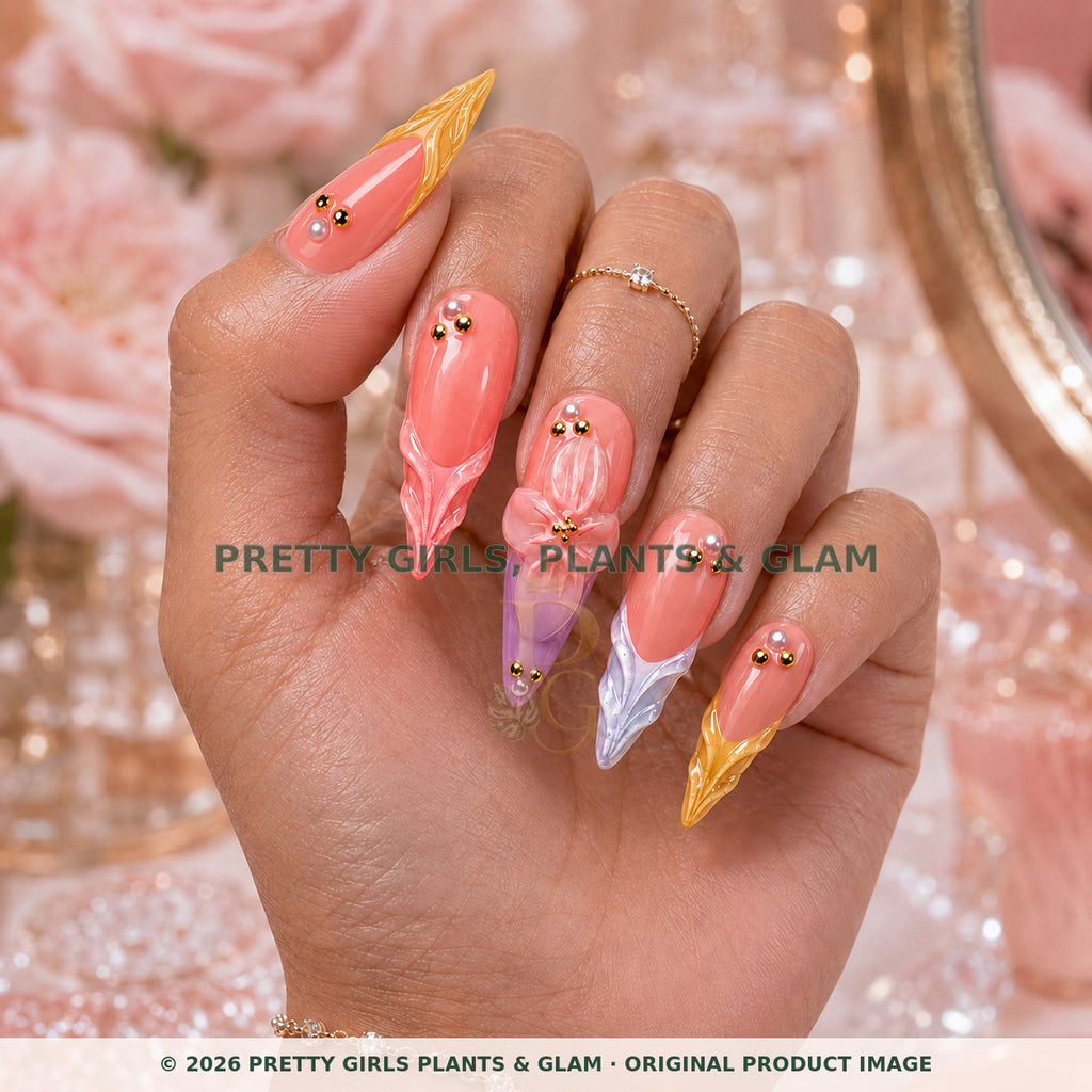 Sunset Petals press-on nails modeled upright on a hand
